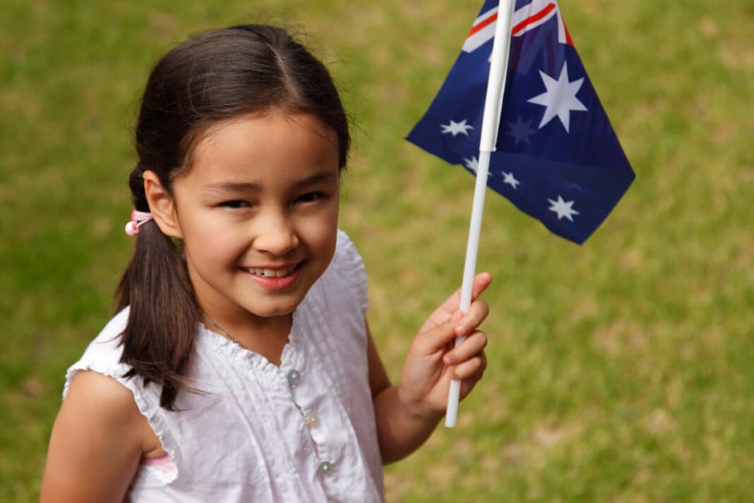 Young Australian person with flag Wood Central 1 e1686129452917