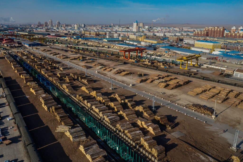 Logs from Russia stacked outside Manzhouli, a Chinese border town, where the wood is processed and then shipped throughout the country and the world. China now makes up more than 60% of Russia's global trade. (Photo Credit: Lam Yik Fei for The New York Times in 2021 taken before the Ukraine War)