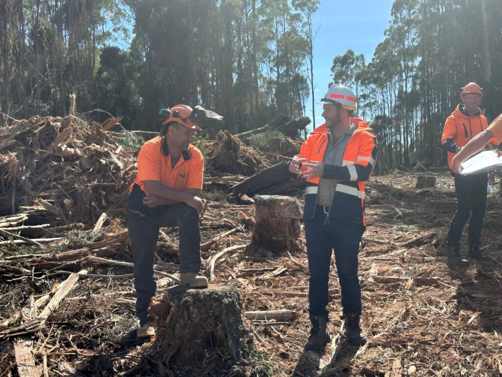 Tasmanian Resources Minister Felix Ellis (pictured centre in the Sustainable Timber Tasmania helmet) has been a strong supporter of Tasmania's native forest industry. (Photo Credit: Supplied, Felix Ellis Office)
