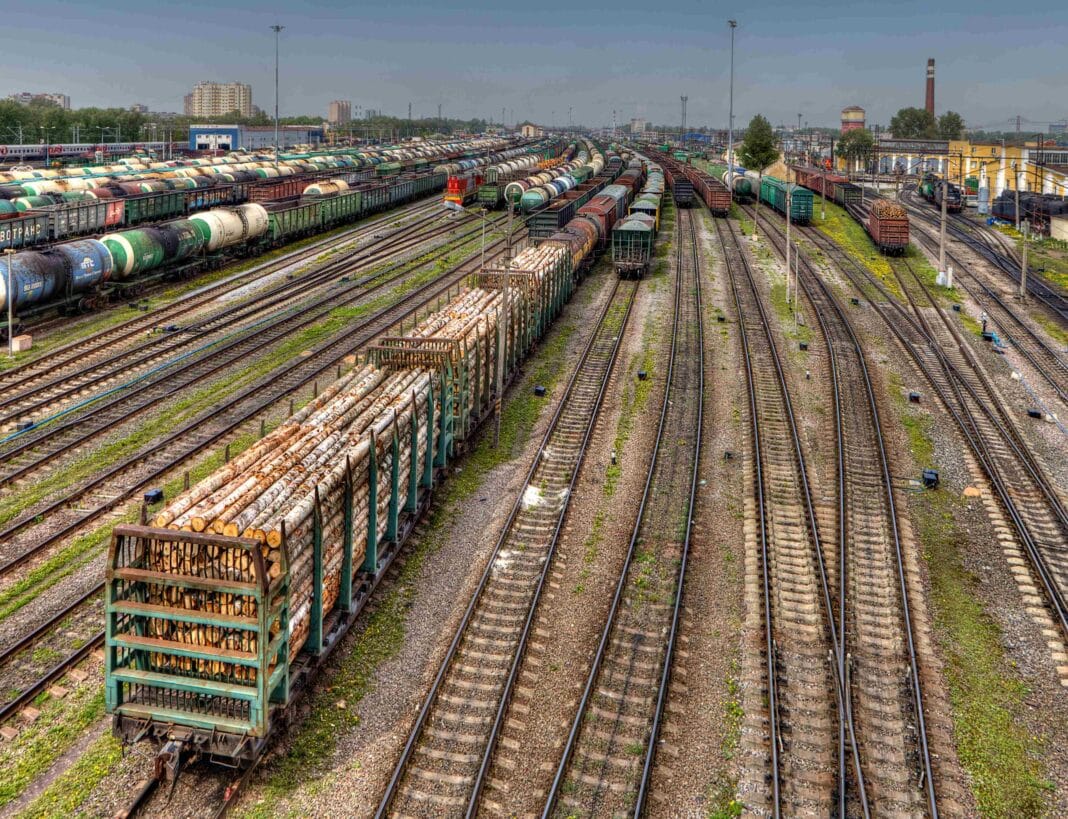 Russian logs continue to travel, via train across Eurasia, as Putin's linked oligarchs continue to get rich on selling timber into western markets. (Photo Credit:Vladimir Grigorev / Alamy Stock Photo)