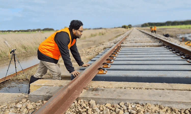 Dr Wahid Ferdous inspects the composite transoms installed on a part of the South Australian rail tr