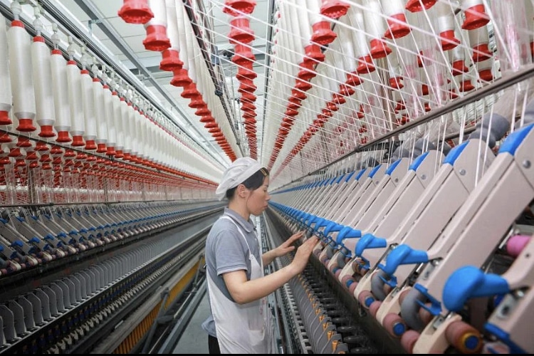 According to the Caixin PMI, factory output and new orders remained in expansionary territory in September. (Photo Credit: AFP)