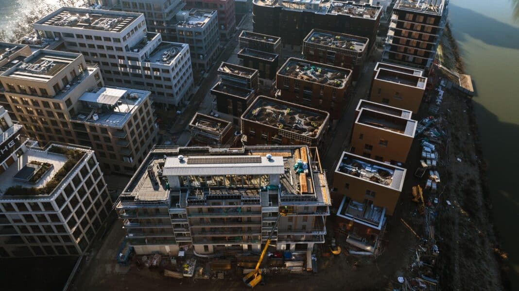 An aerial view of Paris 2024 Olympic Village on January 31, 2024, in Saint-Denis, Paris outskirts, France. With the Paris 2024 Olympic Games in a few months, construction for the Village that will host some 14,000 athletes is in full swing in the Seine-Saint-Denis department, the poorest in mainland France. SOLIDEO, the public institution in charge of construction for the Olympics, promises that the Olympic Village will leave a long-lasting legacy in the working-class area, where 25 per cent of residents live below the poverty line. Once the Games are over, the village will be transformed into a new neighbourhood with space for 6,000 residents. The area will have offices, shops, cultural and sporting venues, schools and a 3.5-hectare park. (Photo Credit: Drone Press/ABACAPRESS.COM)