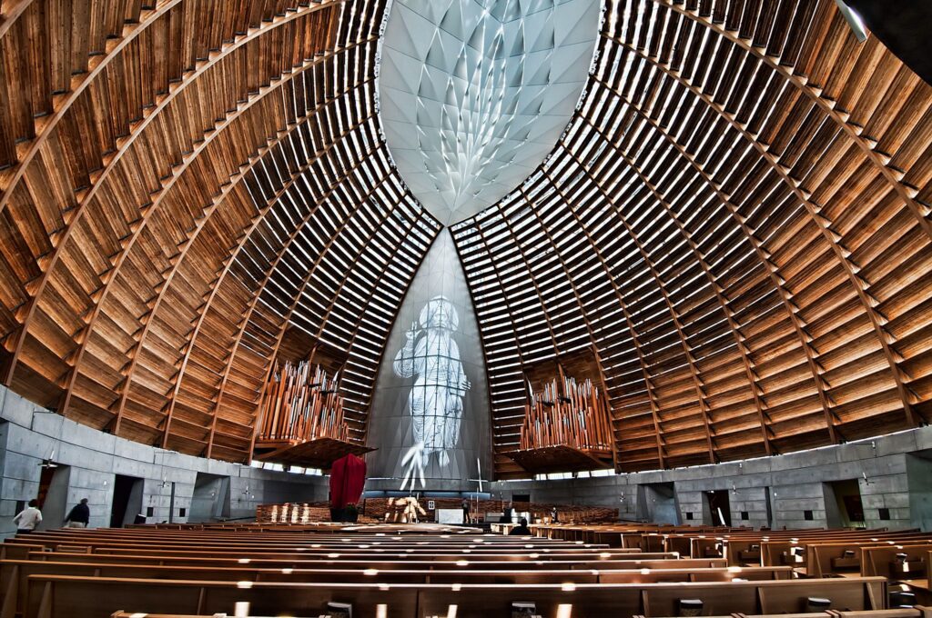Oakland's ultra-modern Cathedral of Christ the Light has been described as the "ultimate engineering challenge." The building incorporates a glulam and steel skeleton and has been built over a high seismic area - to replace a previous cathedral destroyed by the 1989 earthquake. (Photo Credit: Christian Ortiz under Creative Commons CC BY-NC-SA 2.0 DEED)