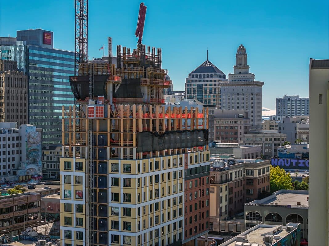 US developers are now using new forms of mass timber, like mass ply panelling to build faster, greener and lighter mid-rise and high-rise buildings across the US. Including the world's first post and plate high-rise in Oakland, California. (Photo Credit: DCI Engineers)