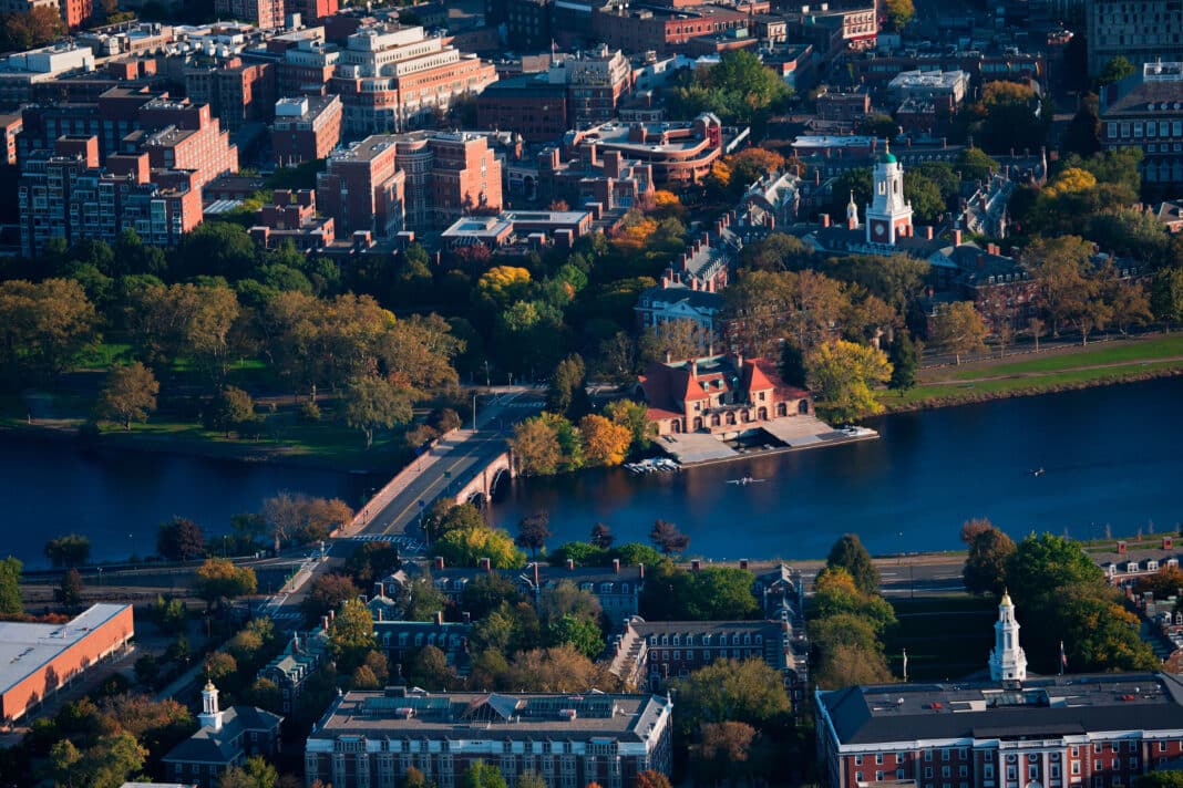 Ariel view of Cambridge and Anderson Memorial Bridge leading to Weld Boathouse, Harvard on Charles River, Cambridge, Boston. Havard University is turning to mass timber as part of its new $750 million Enterprise Research Campus - one of the Northeast’s largest and most ambitious projects using mass timber construction systems. (Photo Credit: spiritofamerica from Adobe Stock Images)