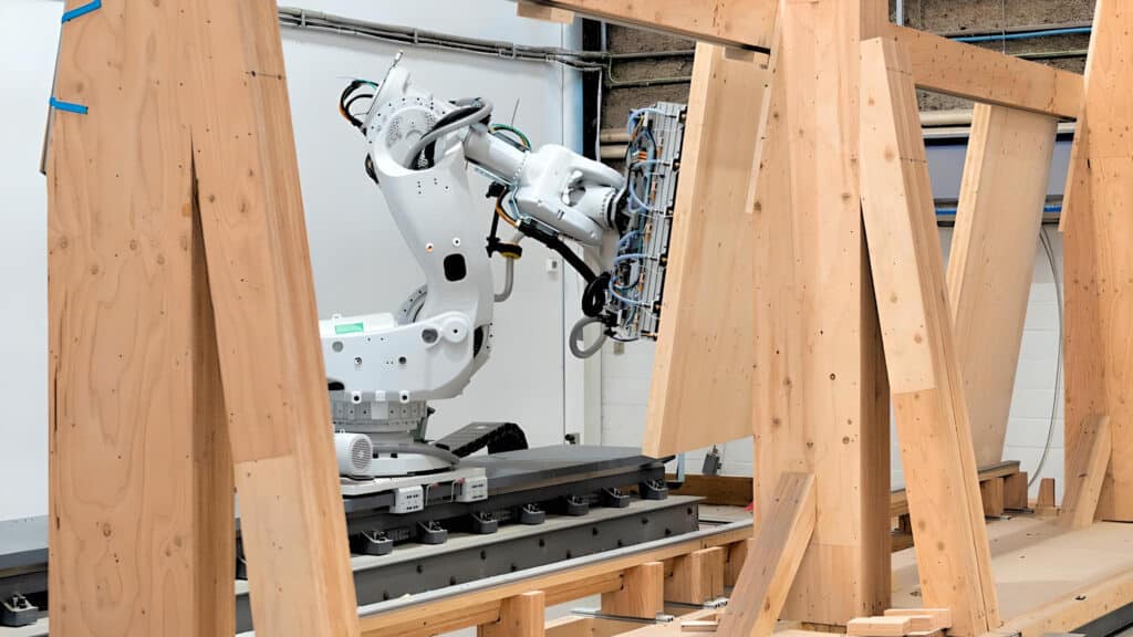 Intelligent City is a Vancouver company that produces mass timber housing. The facility uses robotics and digital technology to bring together panel design and production, two processes that are usually carried out separately and sequentially. (Photo Credit: Journal of Commerce via Intelligent City)