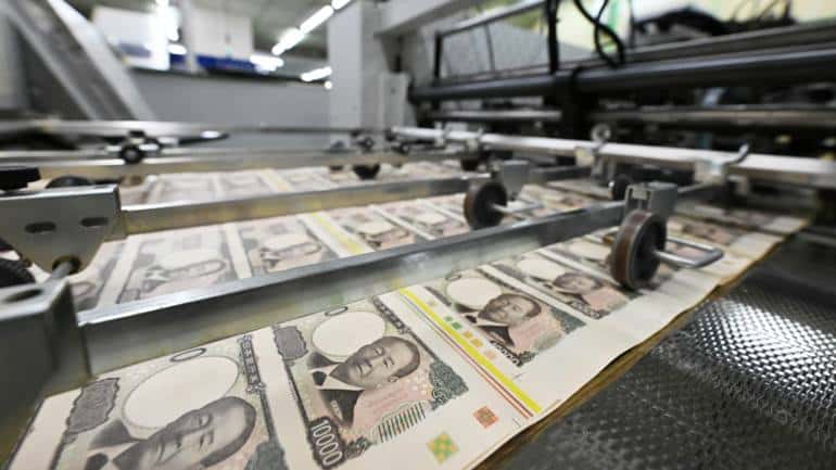 New 10,000 yen bank notes made from forest shrubs that thrive in the Himalayan Mountains roll off the production line at the National Printing Bureau in Tokyo. (Photo Credit: Mizuho Miyazaki)