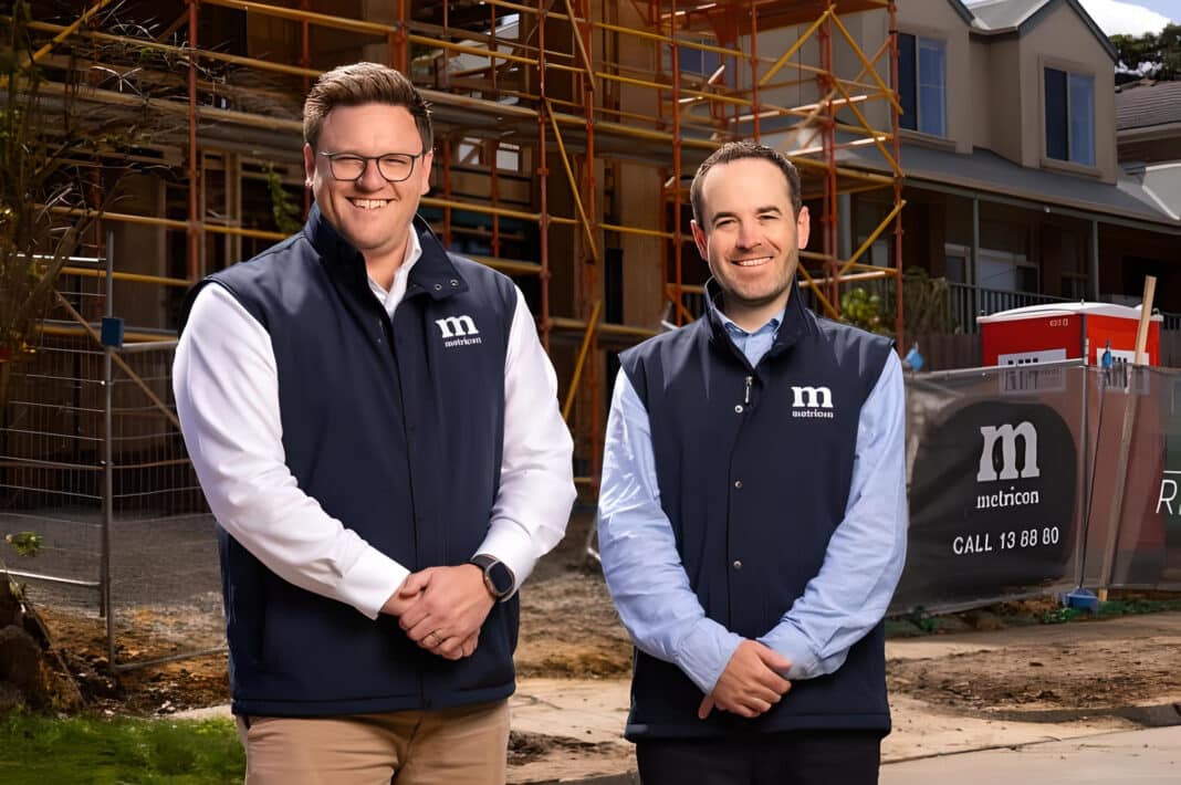 Metricon CEO Brad Duggan and CFO Jon Robson outside one of 4,000 primarily timber framed dwellings built by Metricon every year. Yesterday Japanese forest giant Sumitomo Forestry announced a 51% buy out of Australia's largest house builder.