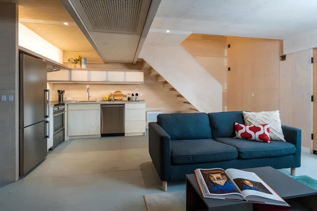 Living space and kitchen on the ground floor of the mass plywood panel house. (Photo Credit: Marcus Kaufmann/University of Oregon)