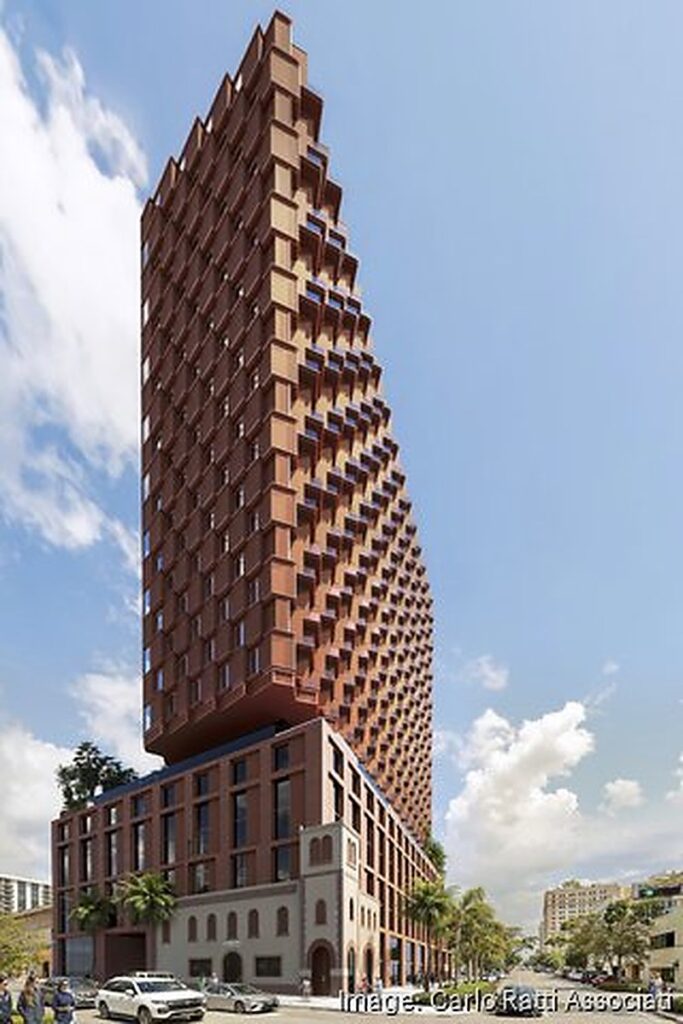 Three-quarter render of the proposed West Palm Beach timber tower showing its stepped, tapering timber facade and street-level podium.