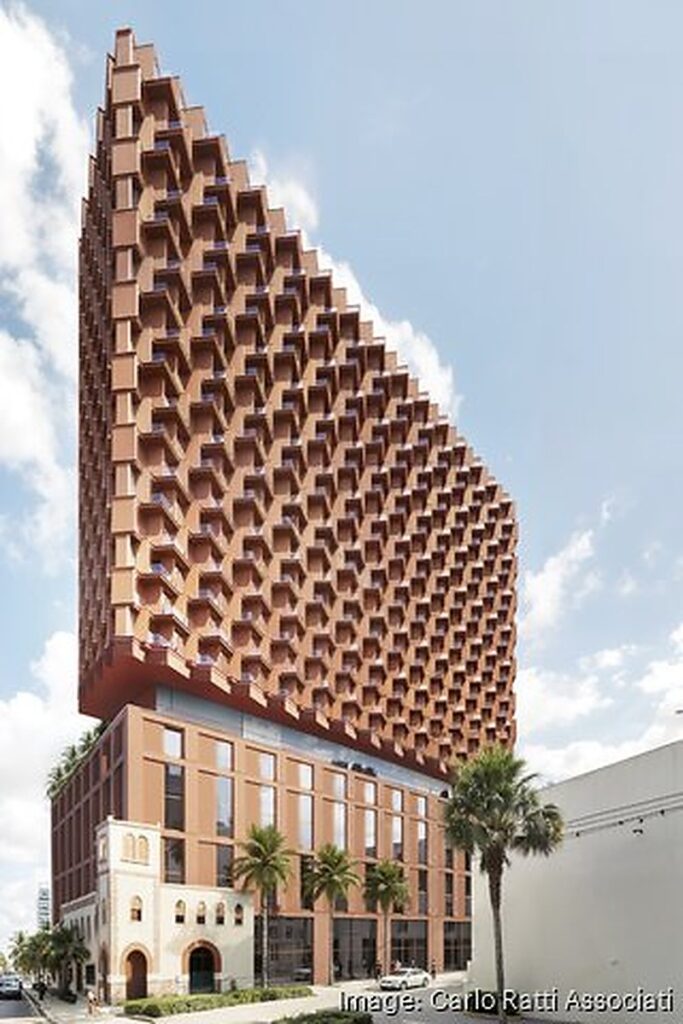 Frontal render of the proposed West Palm Beach timber tower, its faceted facade narrowing to a sculptural peak above a brick base.